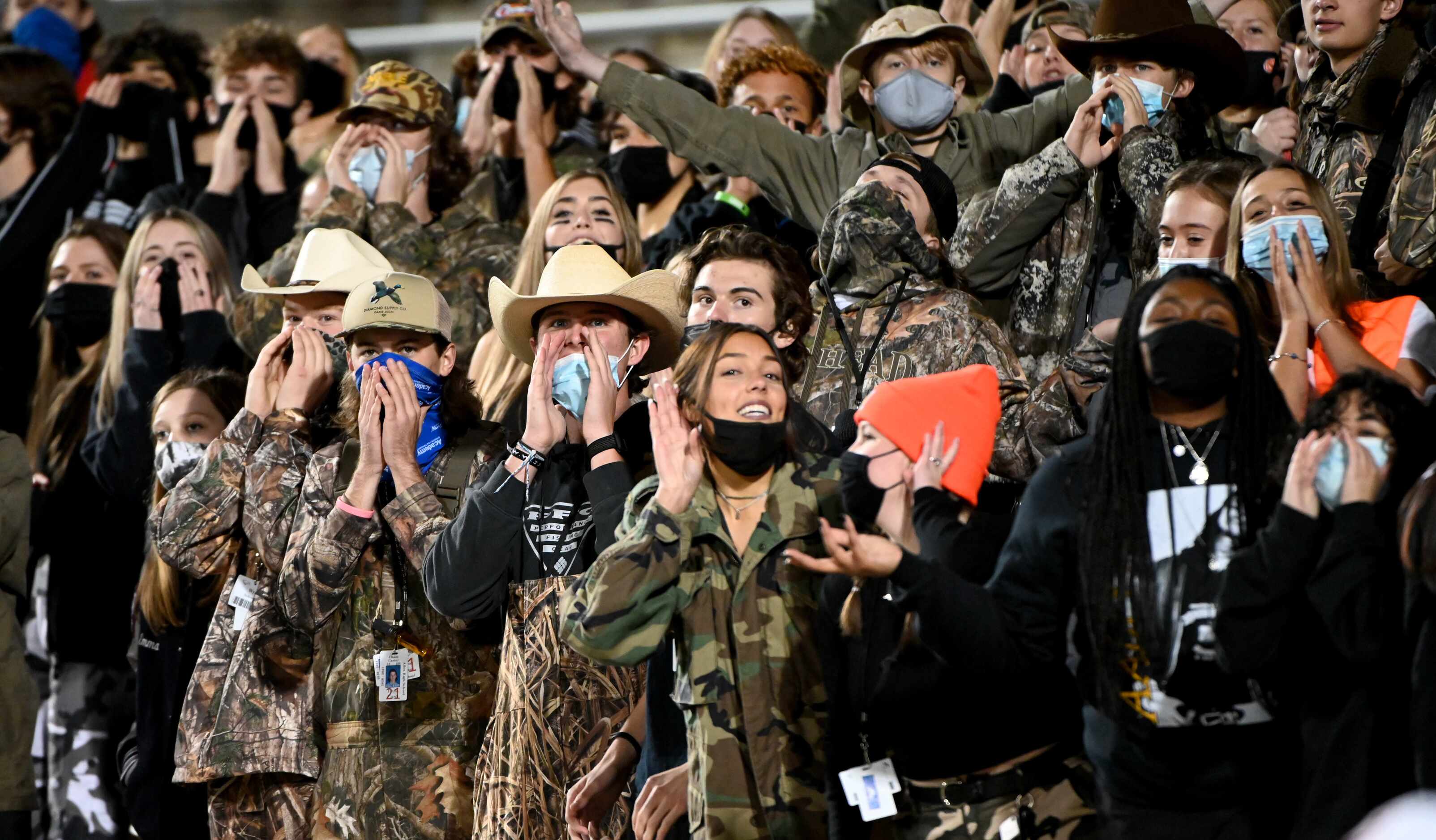 Allen students cheer in the first half of a Class 6A Division I bi-district round playoff...