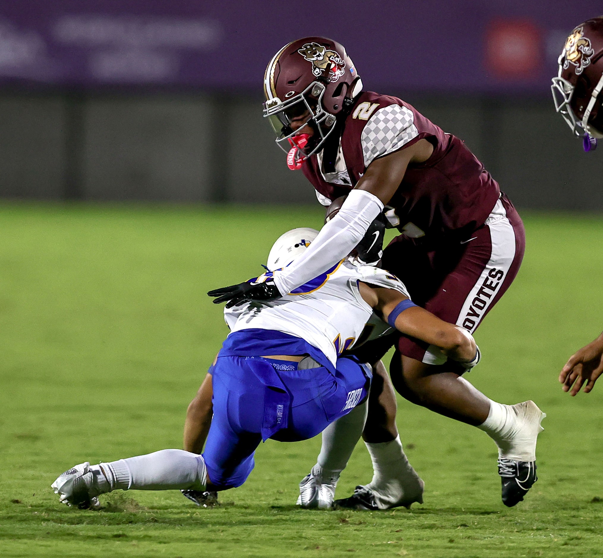 Frisco Heritage wide receiver Tatum Bell (2) is hit for no gain by Frisco linebacker Jackson...