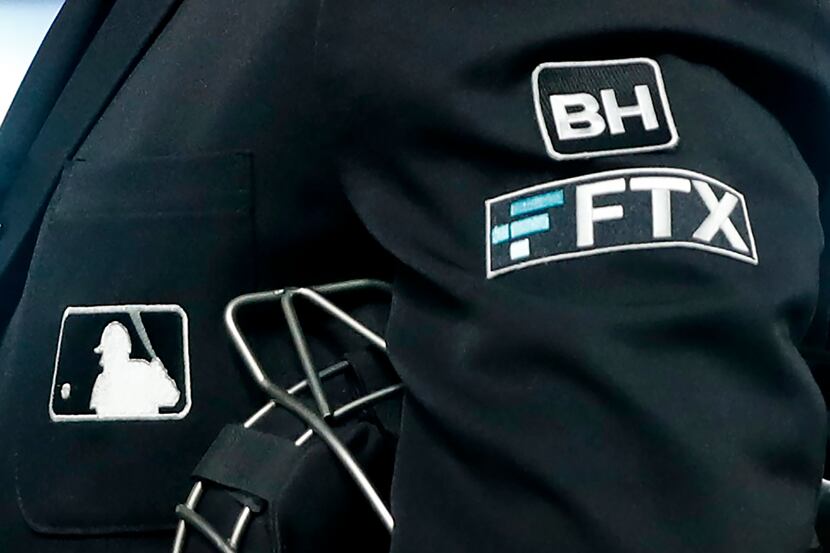 Major League Baseball umpires wore the FTX logo on their game uniforms during the 2022...