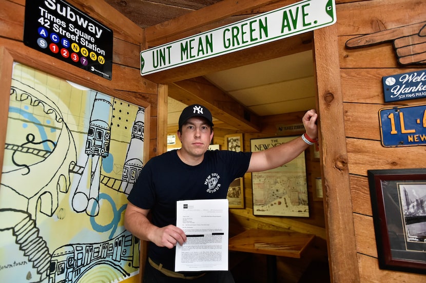 Hunter Christiansen, the owner of New York Sub Hub, holds an offer letter from the...