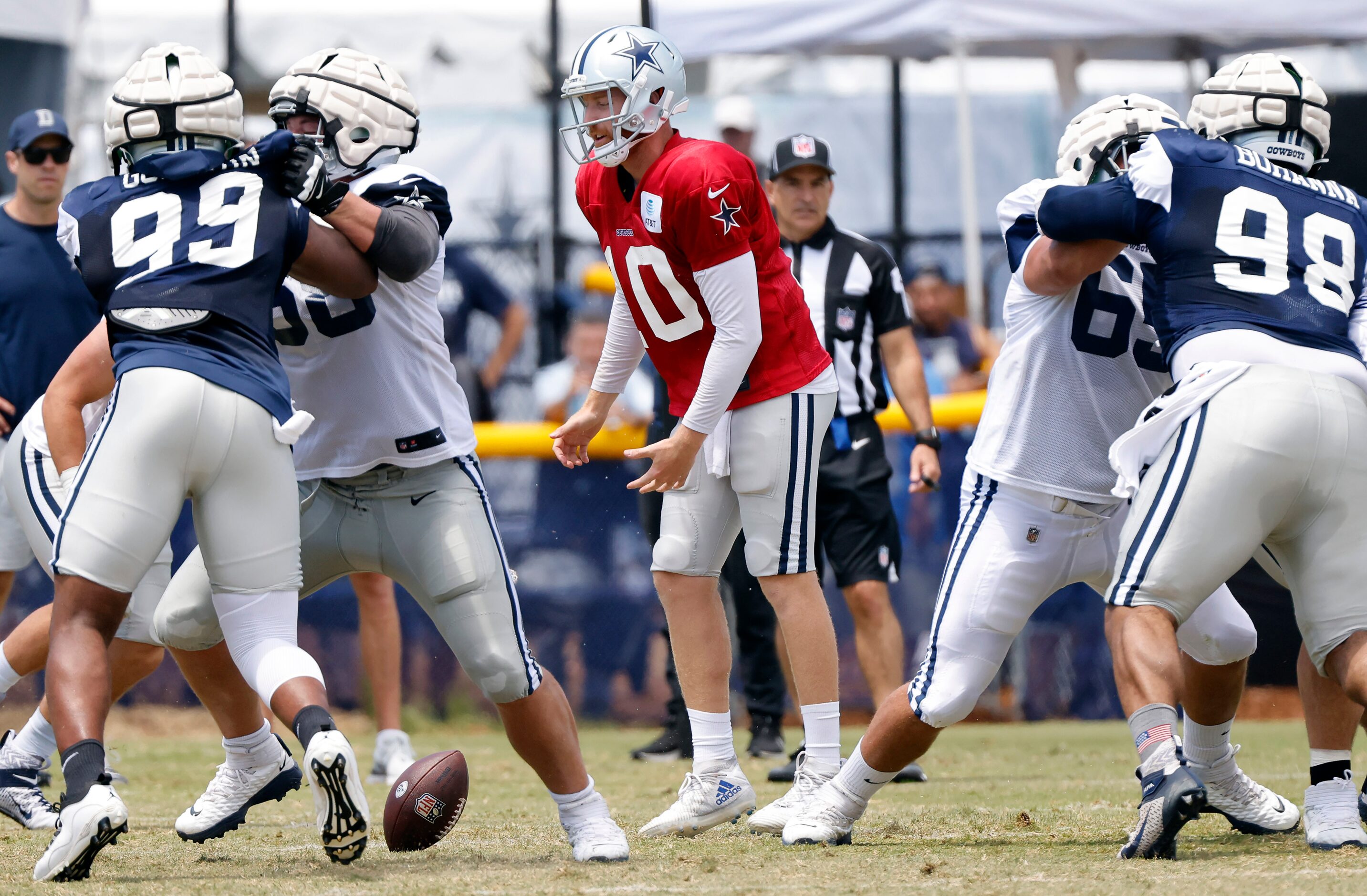 Dallas Cowboys quarterback Cooper Rush (10) reacts after dropping a snap from center Tyler...