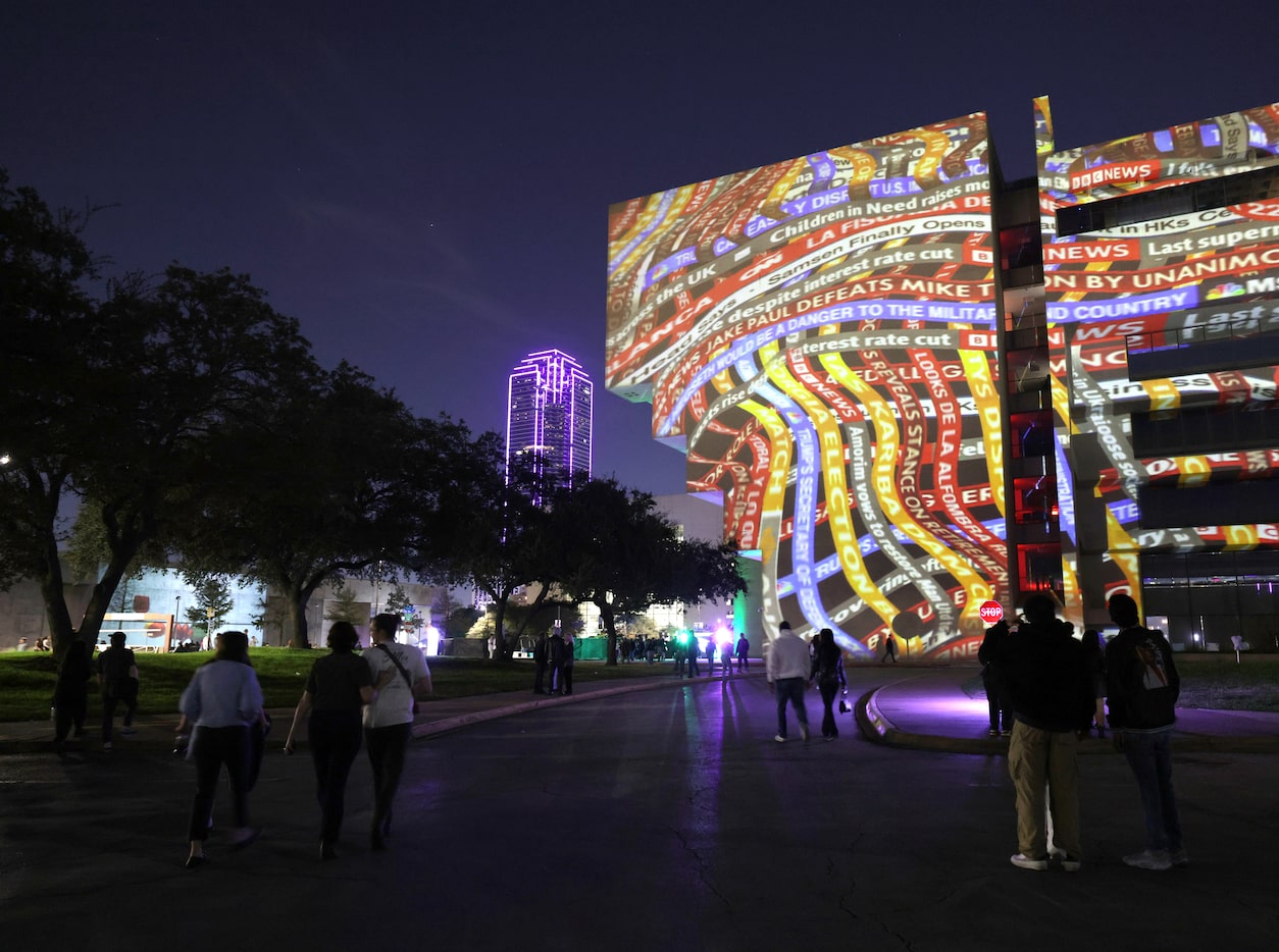 Community members interact with art installations during Aurora in downtown Dallas, TX, on...