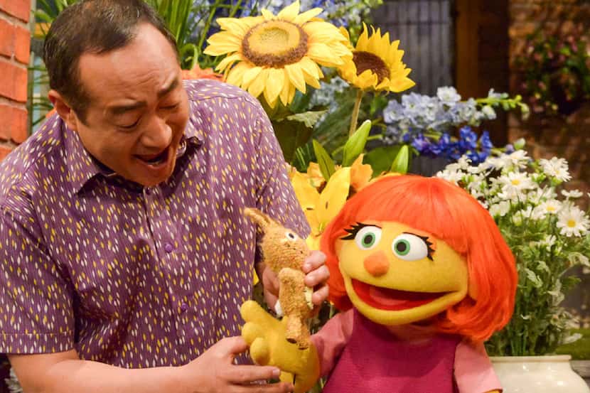 This image released by Sesame Workshop shows Julia, a new autistic muppet character debuting...