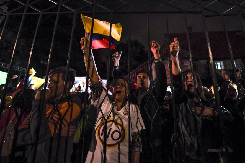 People protest after knowing the results of a referendum on whether to ratify a historic...