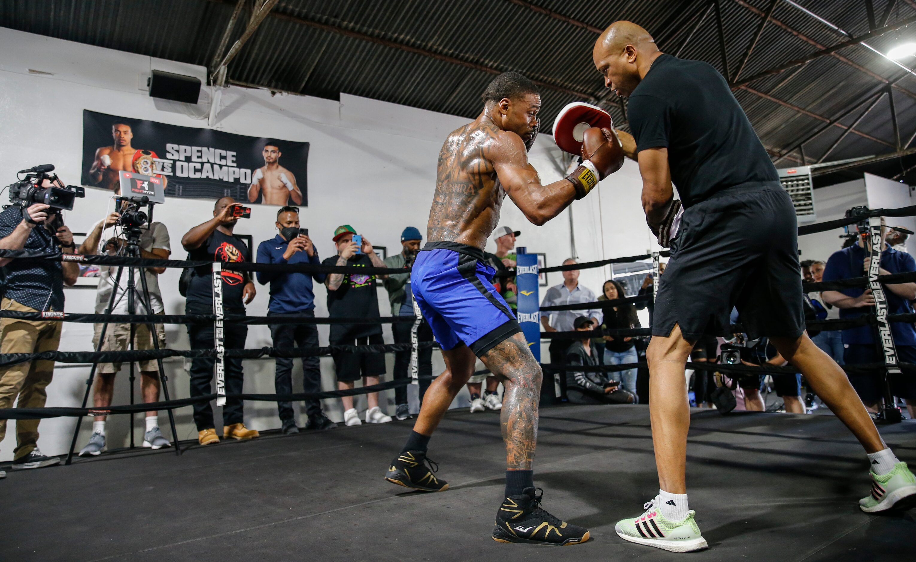 Errol Spence Jr. of Desoto, left, practices with his coach Derrick James during a media...