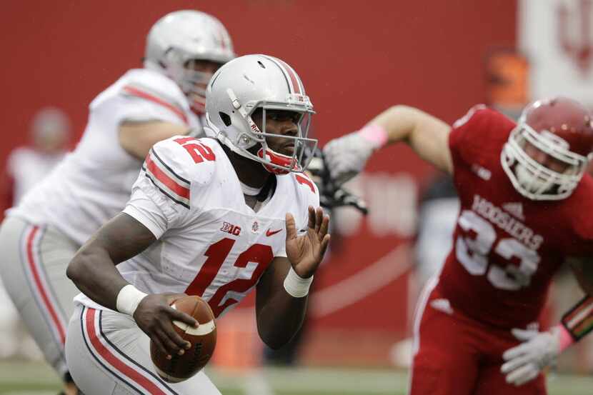 Ohio State's Cardale Jones runs during the second half of an NCAA college football game...
