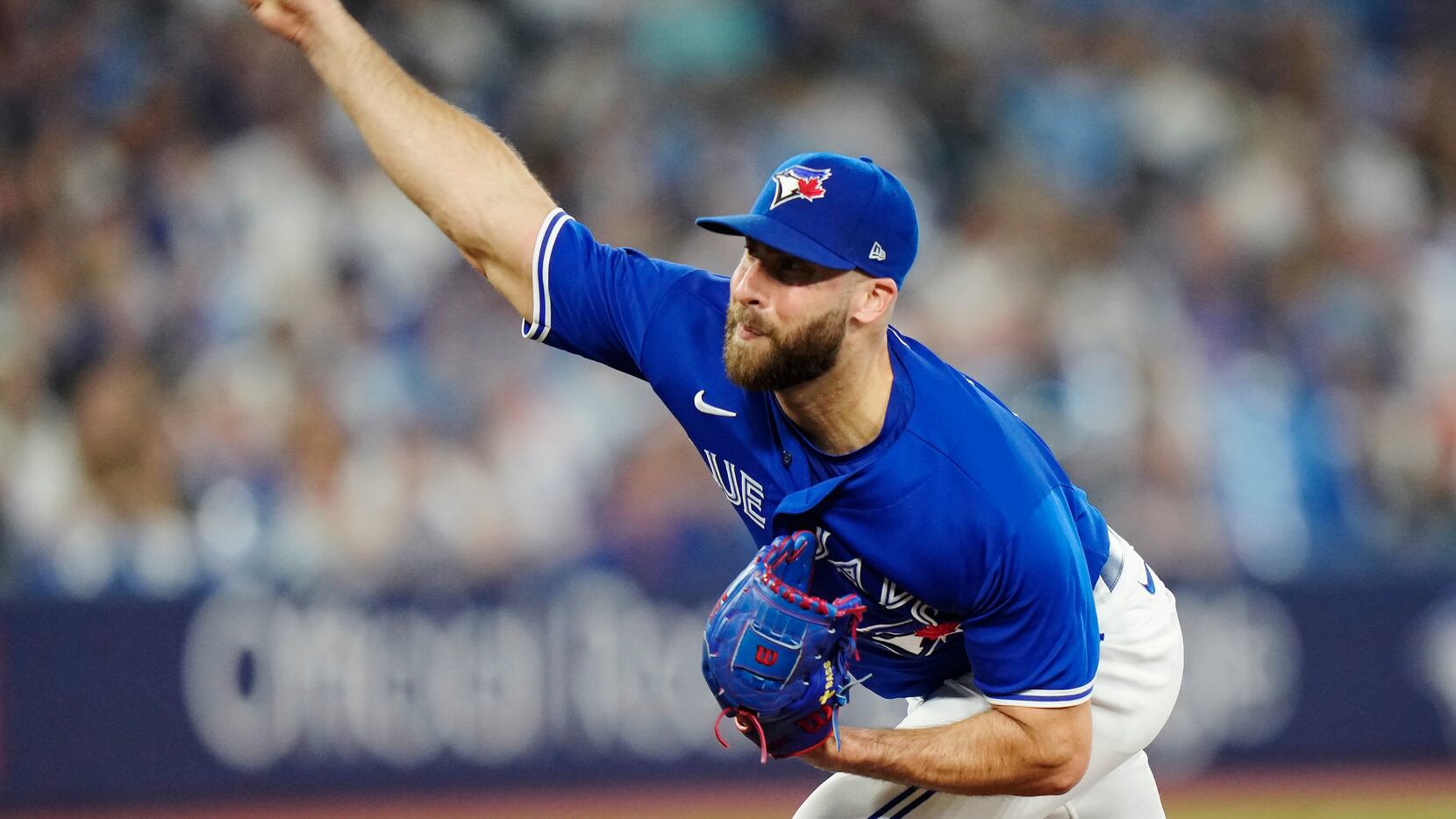 Toronto Blue Jays relief pitcher Anthony Bass works against the Milwaukee Brewers during the...