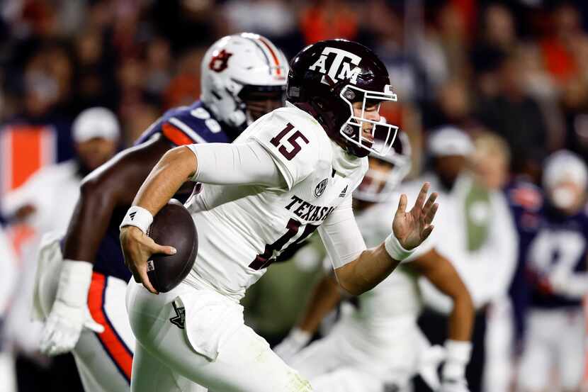 Texas A&M quarterback Conner Weigman (15) carries the ball against Auburn during the first...