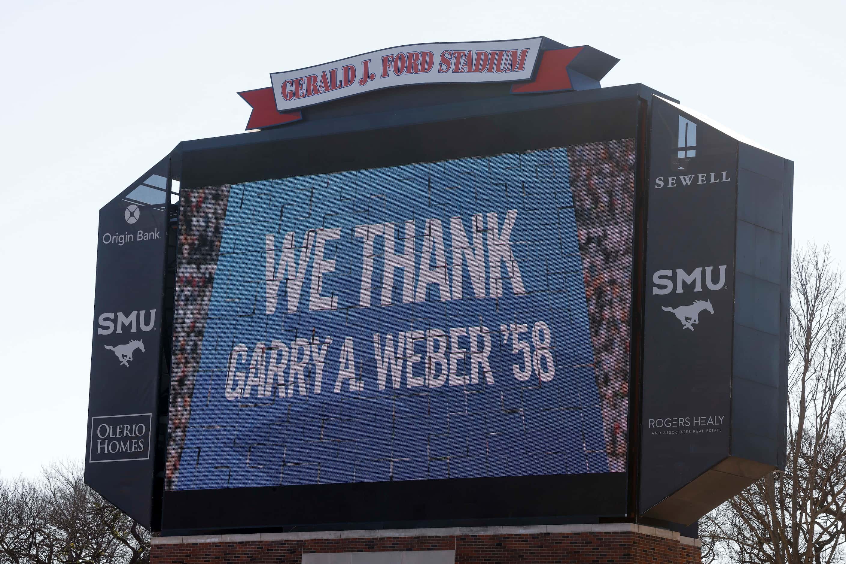 The video board displays a thank you message after a press conference announcing a $50...