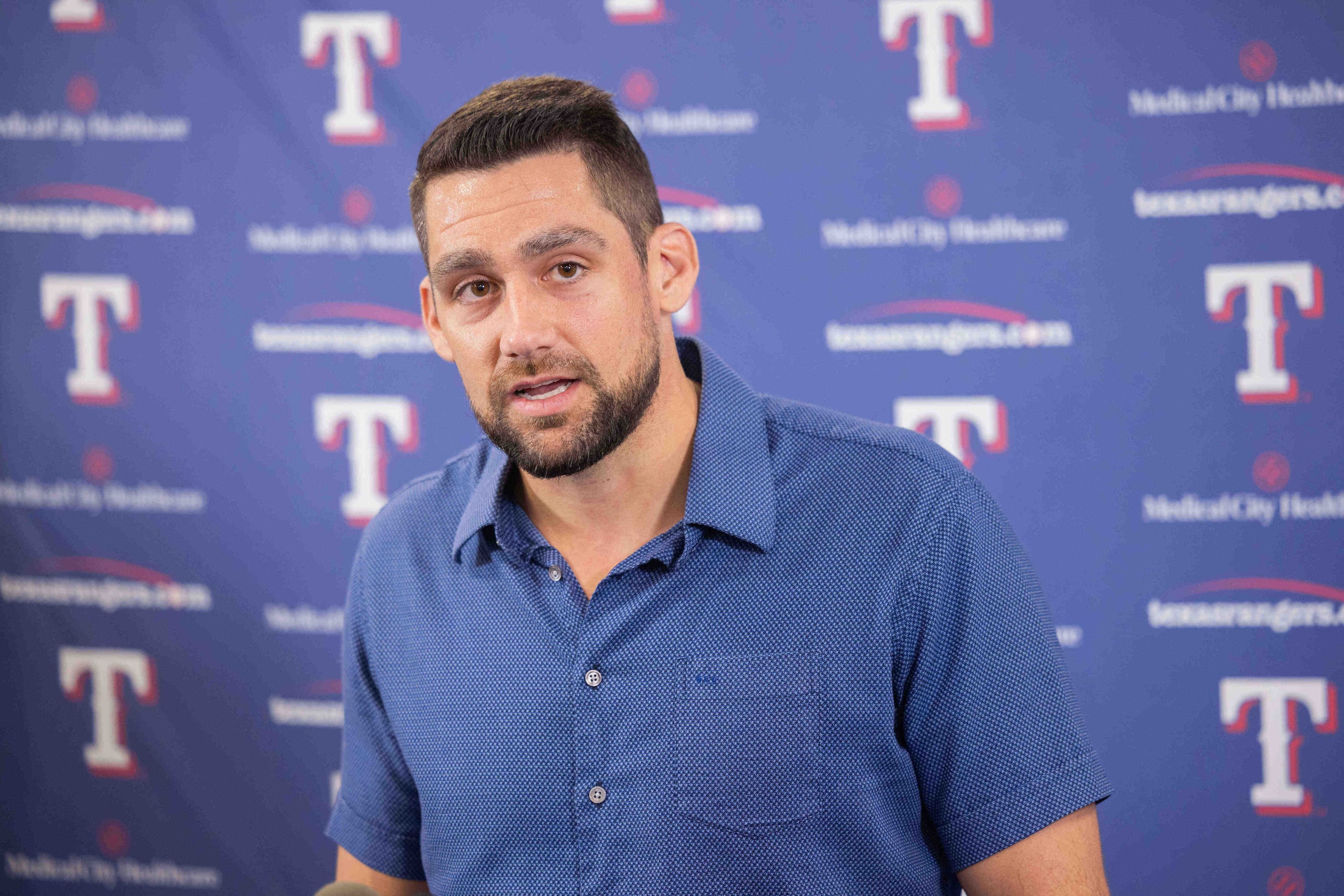 Texas Rangers starting pitcher Nathan Eovaldi speaks during a press conference announcing...