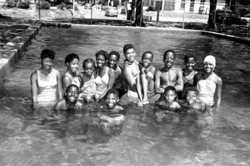 An archived photo shows swimmers enjoying the pool at Exline Park in July of 1955.