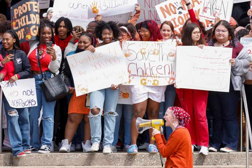 Students chant and carry signs calling for gun reform during a walkout at Townview Magnet...