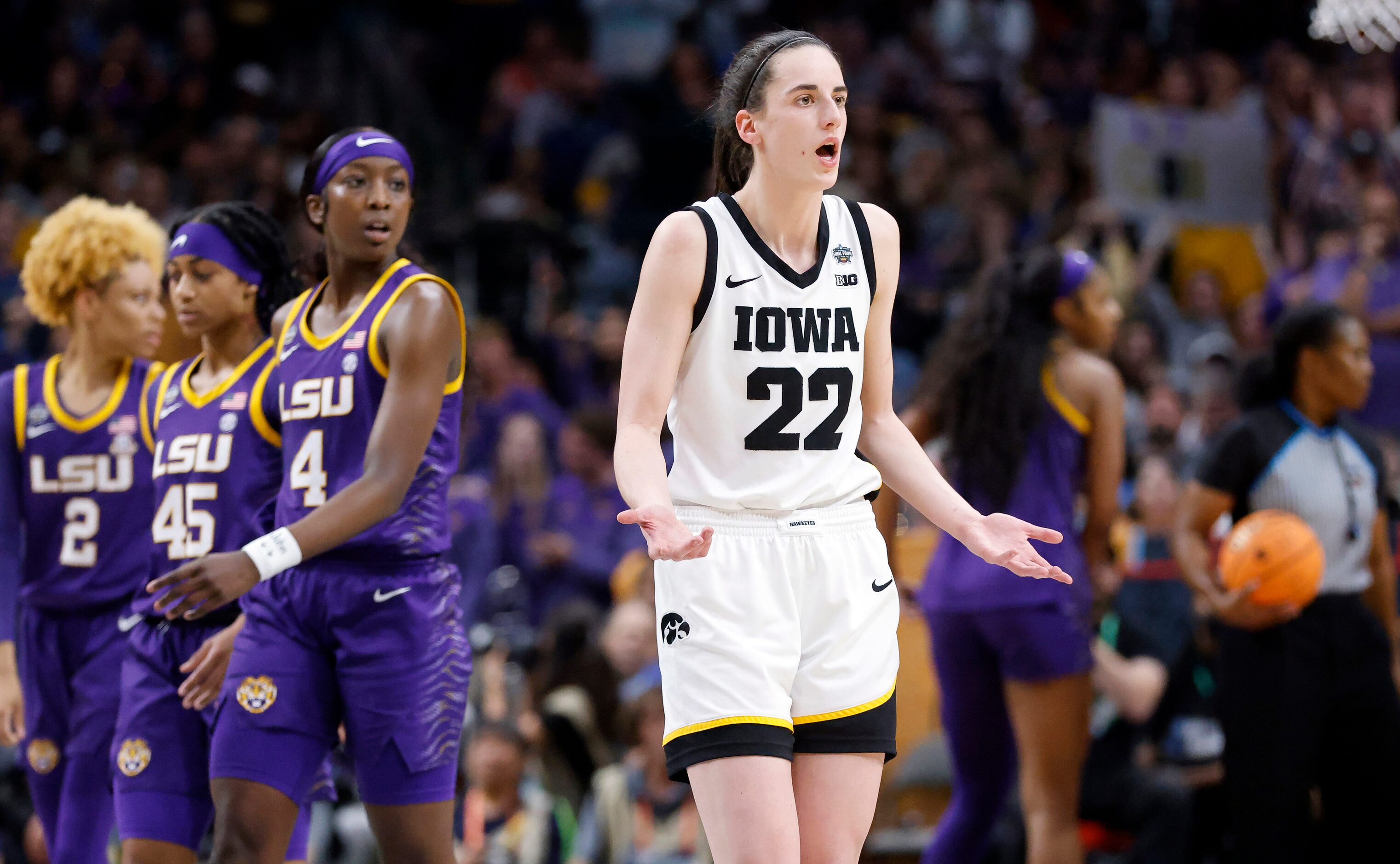 Iowa Hawkeyes guard Caitlin Clark (22) questions why she was called for a technical foul...