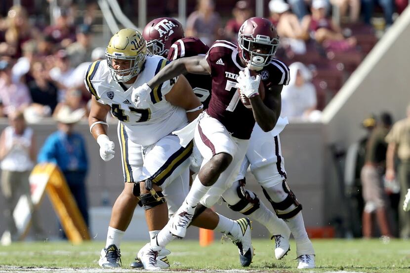 Texas A&M's running back Keith Ford (7) breaks free for first down run against UCLA during...