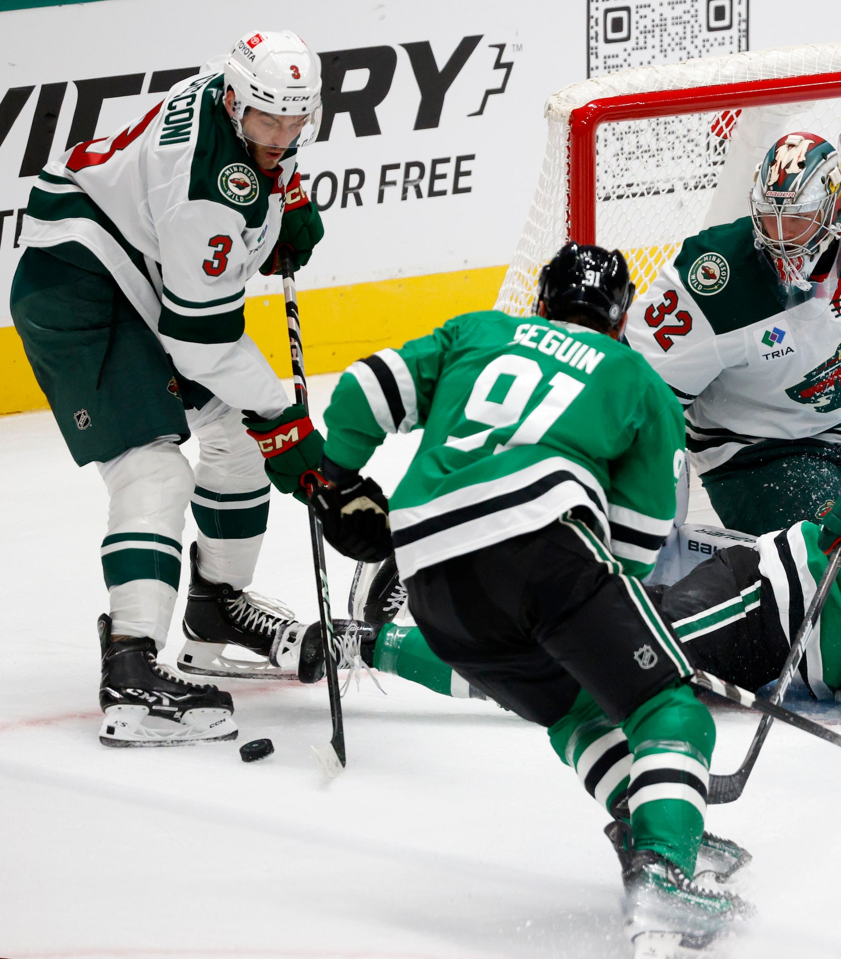 Dallas Stars center Tyler Seguin (91) and Minnesota Wild defenseman Joseph Cecconi (3)...