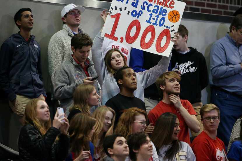 A fan of Southern Methodist Mustangs guard Shake Milton (1) holds up a sign in the second...