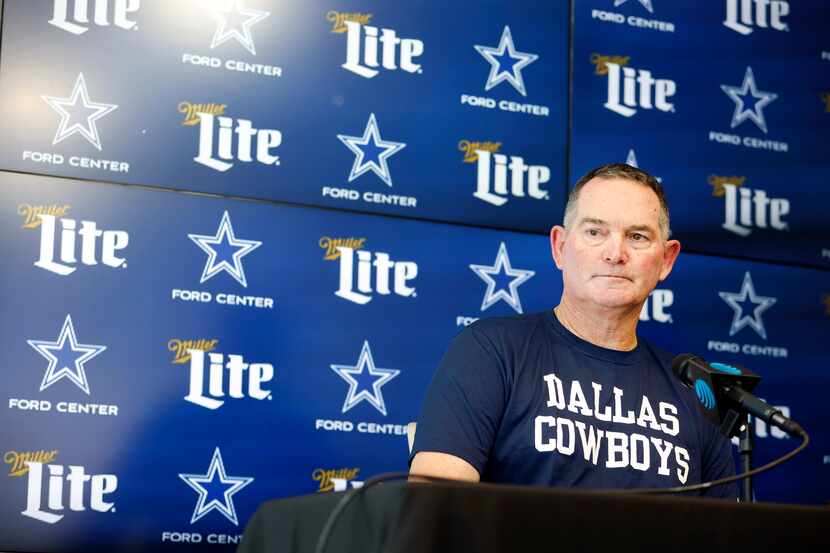 New Dallas Cowboys defensive coordinator Mike Zimmer listens to a question from the media...