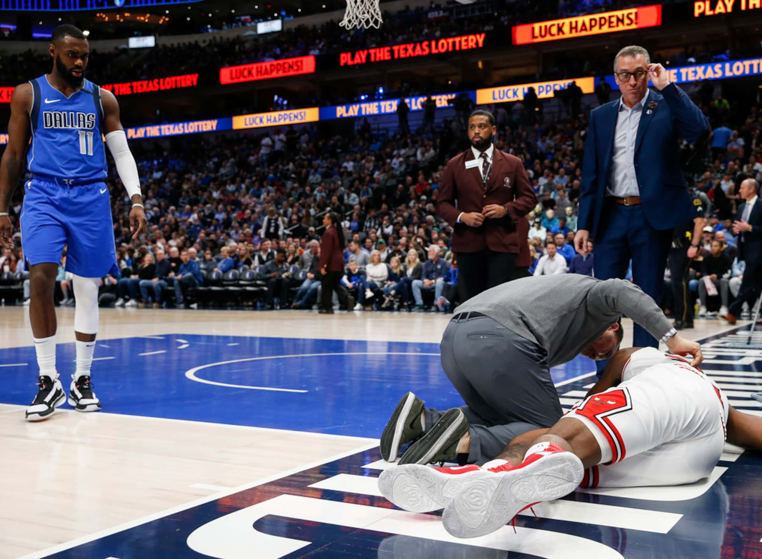 Trainers attend to Chicago Bulls center Wendell Carter Jr. (34) after being injured during...