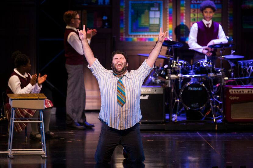 Rob Colletti, who plays Dewey, performs with the cast in School of Rock at Fair Park Music...