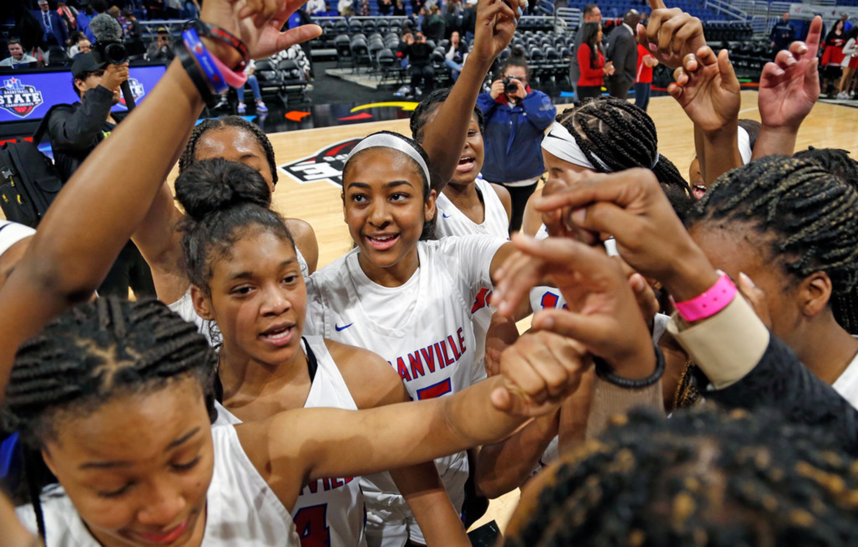 Duncanville gather at center court at the end of the game in a 6A semifina.  Duncanville...