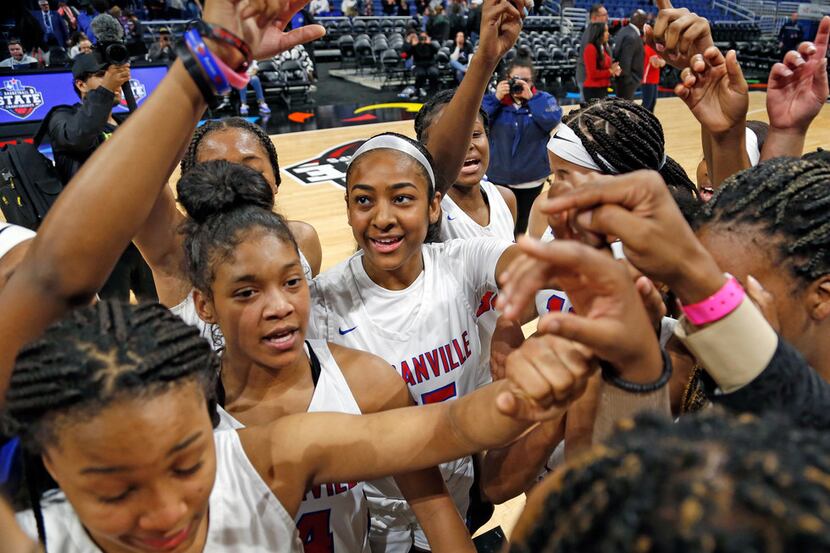 Duncanville gather at center court at the end of the game in a 6A semifina.  Duncanville...