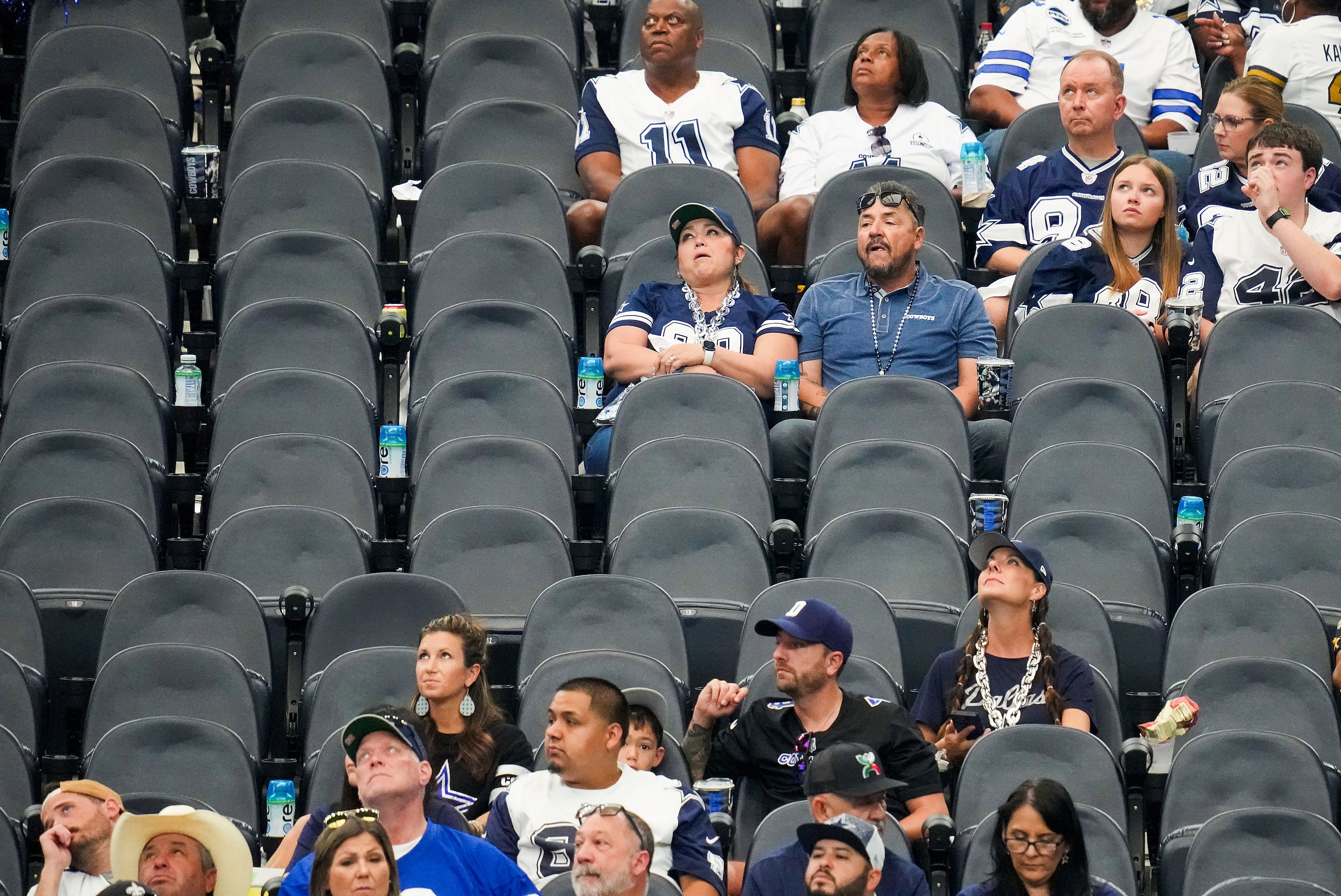 A Dallas Cowboys look on as the stadium empties during the fourth quarter of a loss to the...