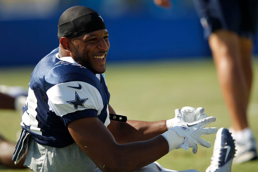 Dallas Cowboys strong safety Barry Church (42) laughs as the team stretches during the...