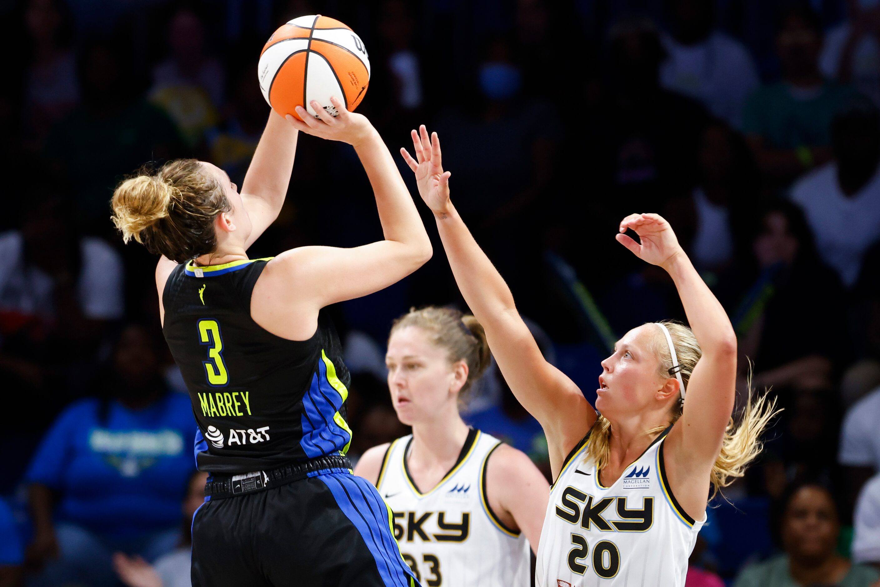 Dallas Wings guard Marina Mabrey (3) shoots a three pointer past Chicago Sky guard Julie...