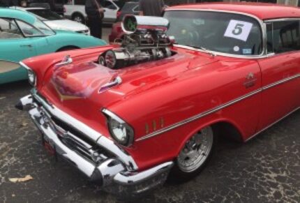  Red 1957 Chevy with Supercharger shows its swagger at Dallas Area Classic Chevy Show in...