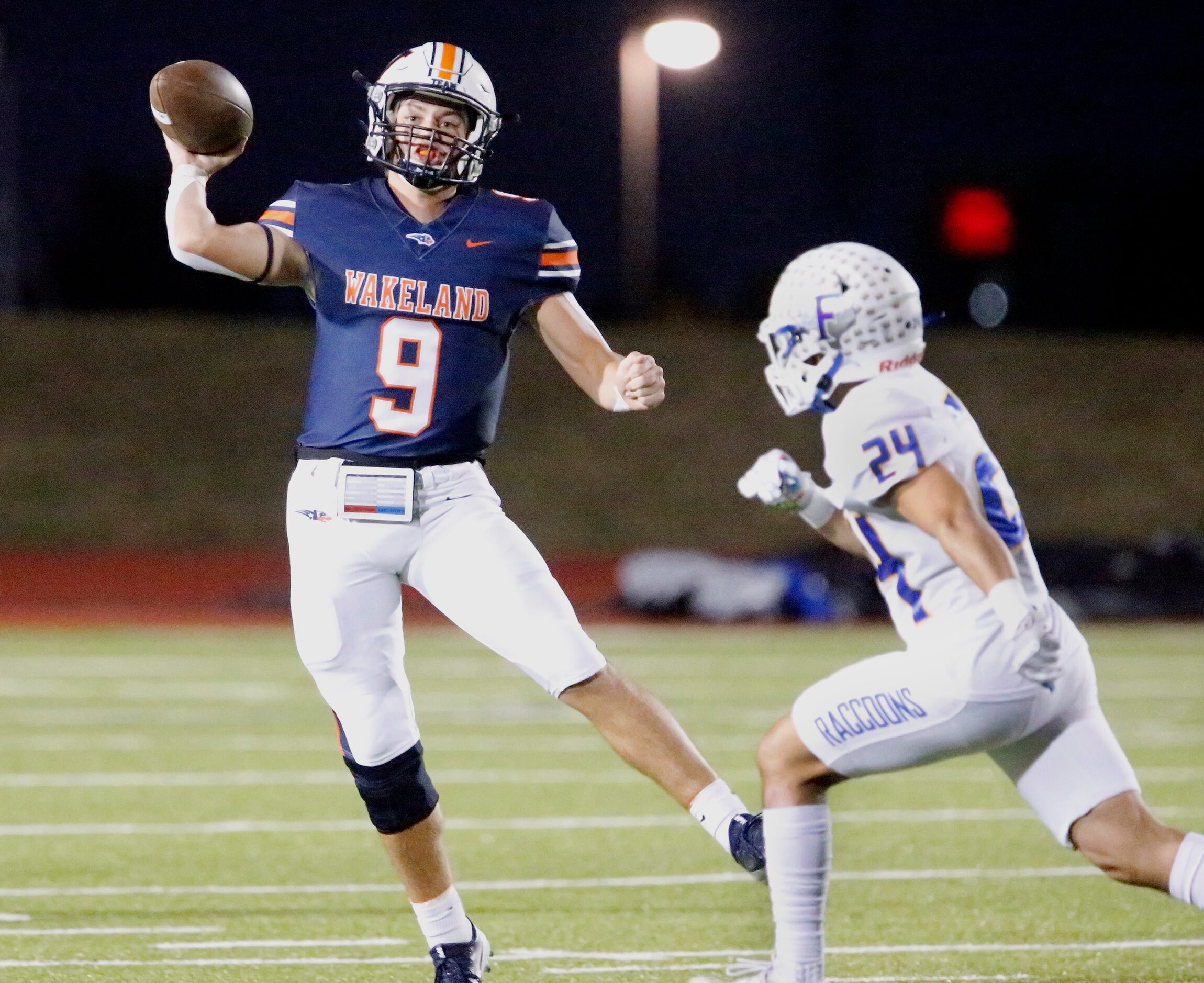 Wakeland High School quarterback Brennan Myer (9) throws a pass on the run while being...