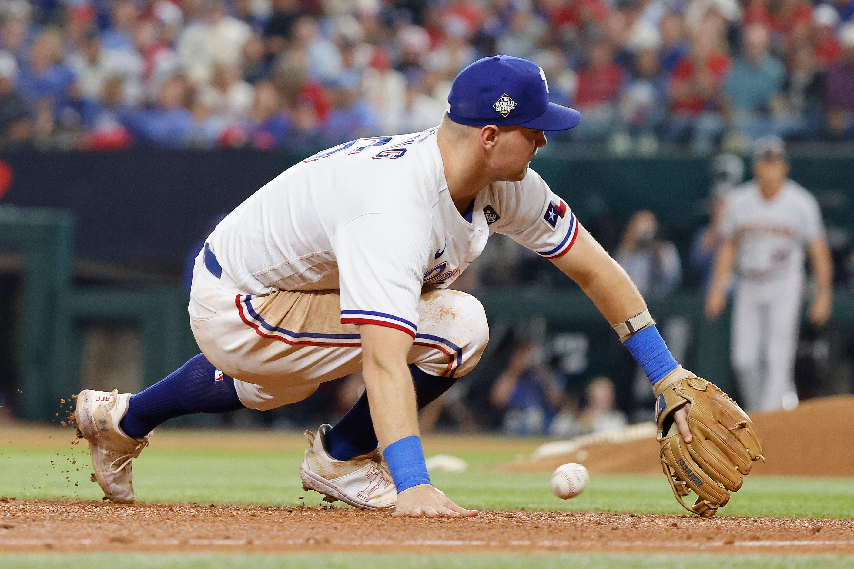 Texas Rangers third baseman Josh Jung deflects an RBI single by Arizona Diamondbacks' Evan...