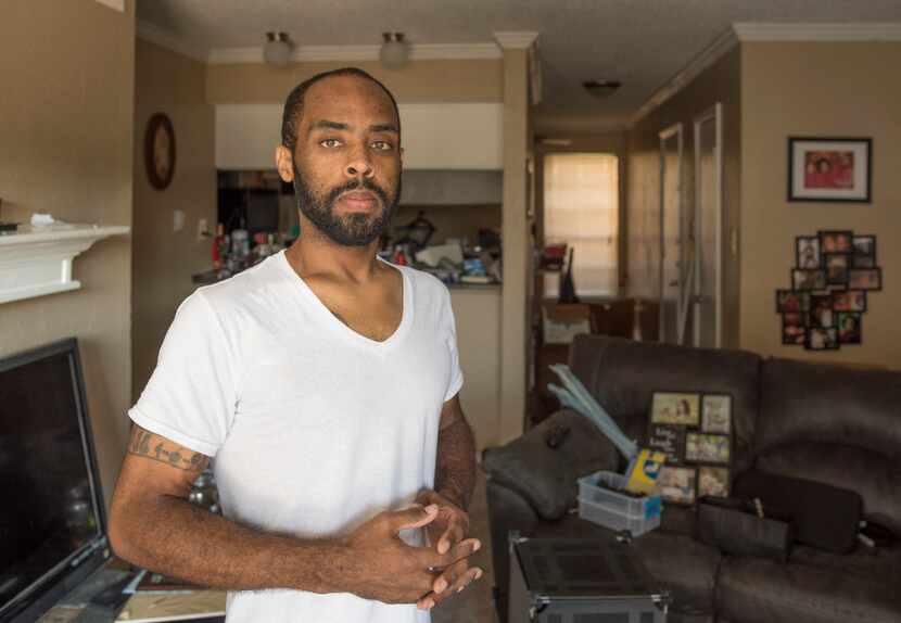 Robin Bobo unpacks in an apartment after living in limbo for weeks because he could not find...