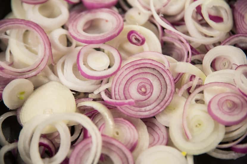 Sliced onions are ready to be caramelized in The Dallas Morning News Test Kitchen. 