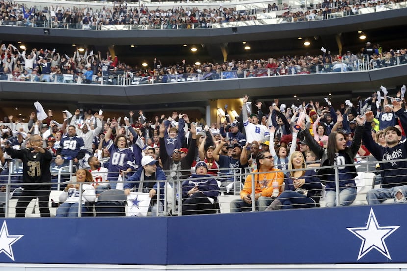 Dallas Cowboys fans do the wave despite the fact there was an injured Washington Redskins...