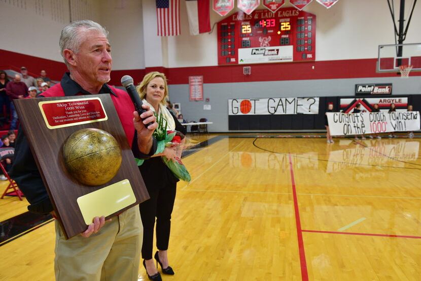 Argyle girls basketball head coach Skip Townsend is honored after getting his 1000th career...