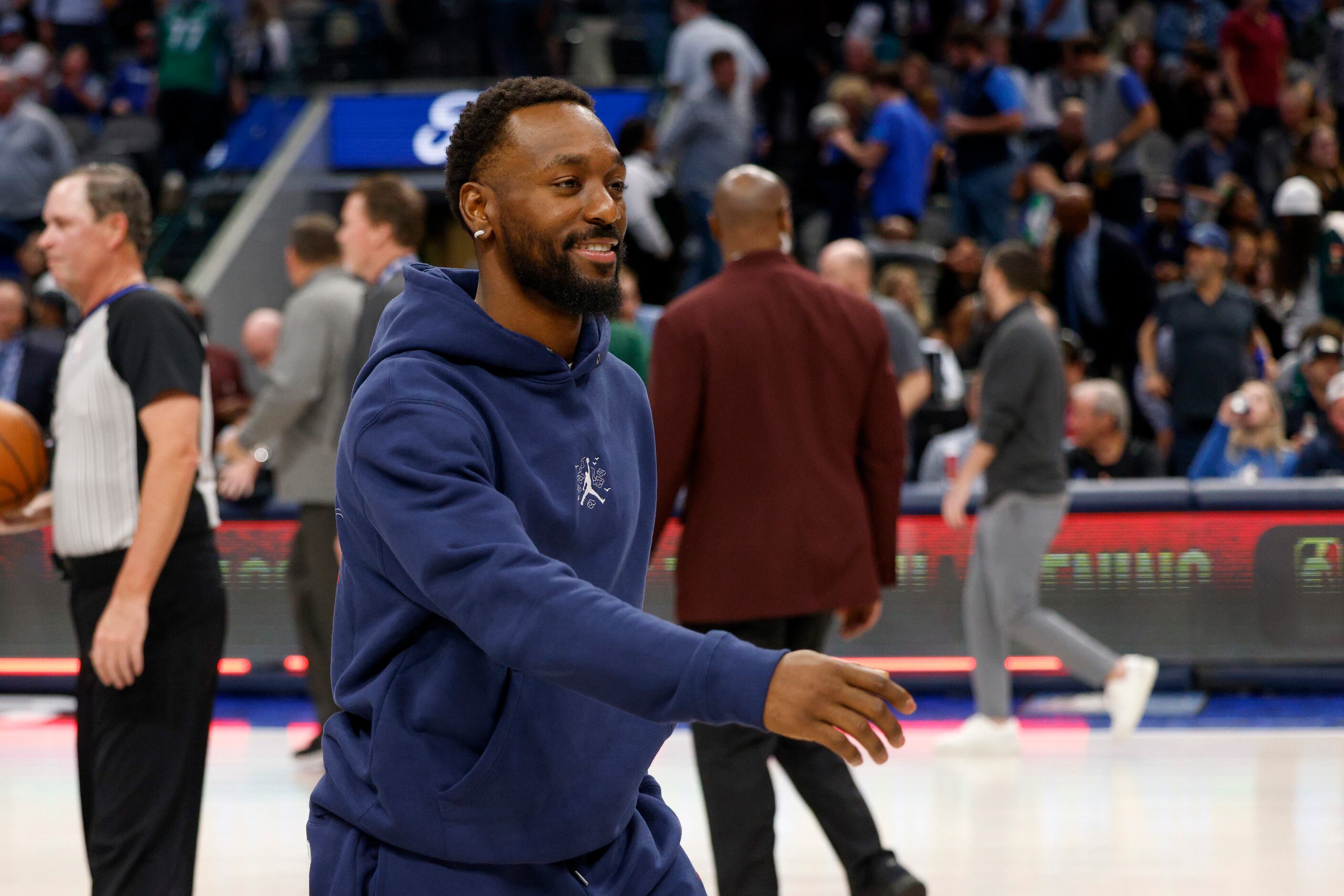 New Dallas Mavericks guard signee Kemba Walker walks to the locker room after the first half...