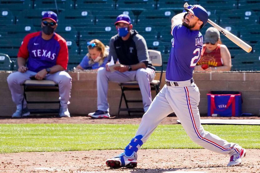 Texas Rangers outfielder David Dahl bats during the fourth inning of a spring training game...