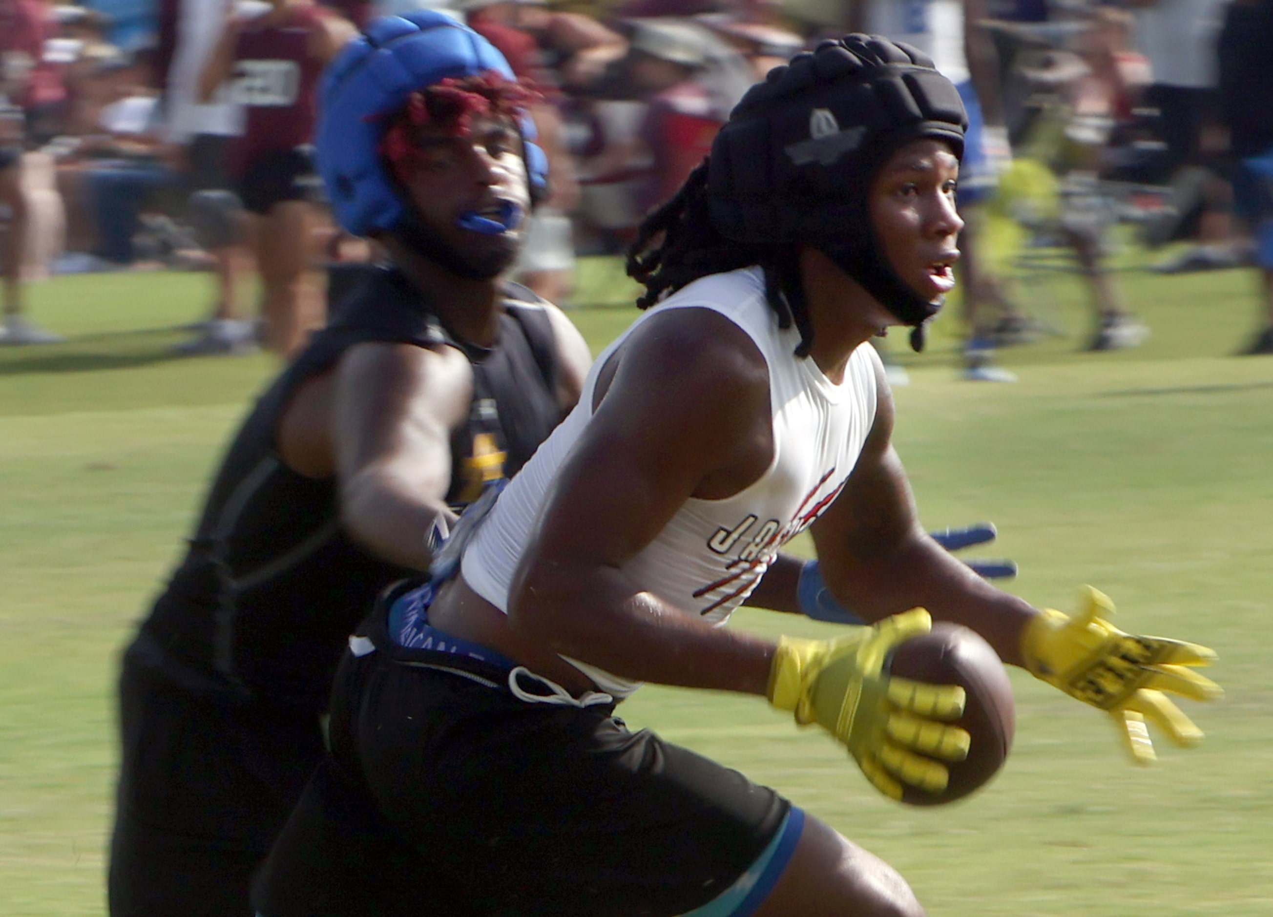 Mesquite Horn's Jeremiah Batiste (4), right, tacks on extra yards after a catch as he is...