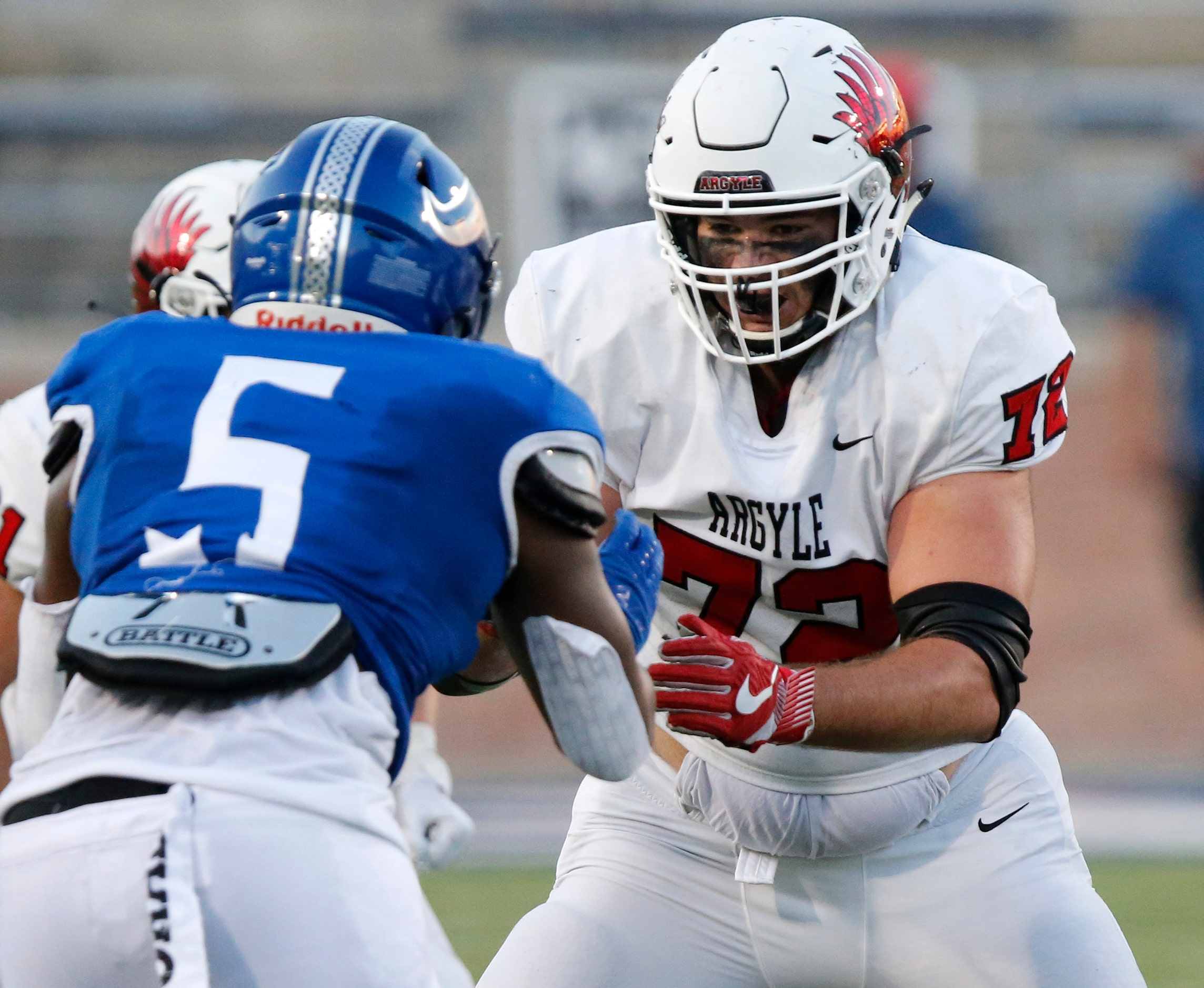 Argyle High School tackle Sheridan Wilson (72) prepares to block Nolan Catholic High School...