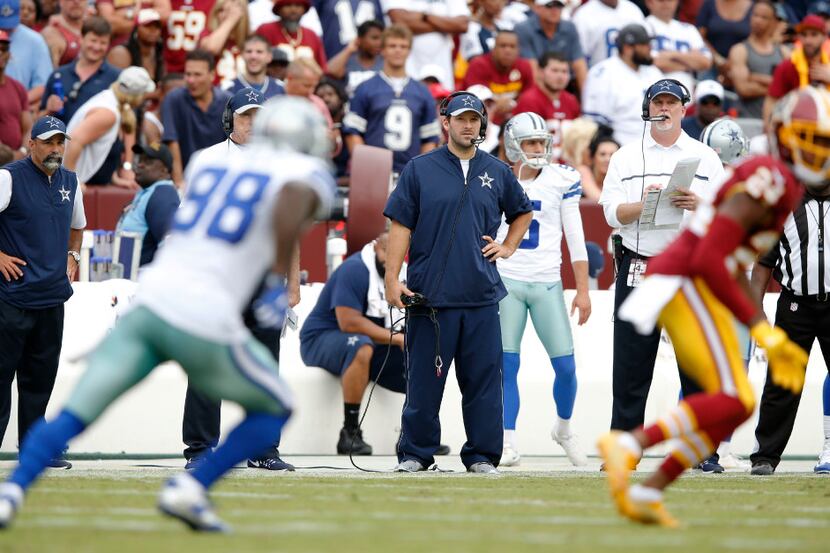 Dallas Cowboys quarterback Tony Romo (9) watches from the sidelines as Dallas Cowboys wide...