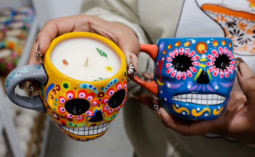 Grecia Alfaro shows candles for the Day of the Dead at her candle shop, “Luz Y Tierra,”...