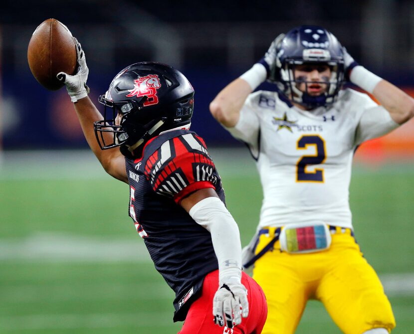 Mansfield Legacy defensive back Jalen Catalon (5) comes up with an interception as Highland...