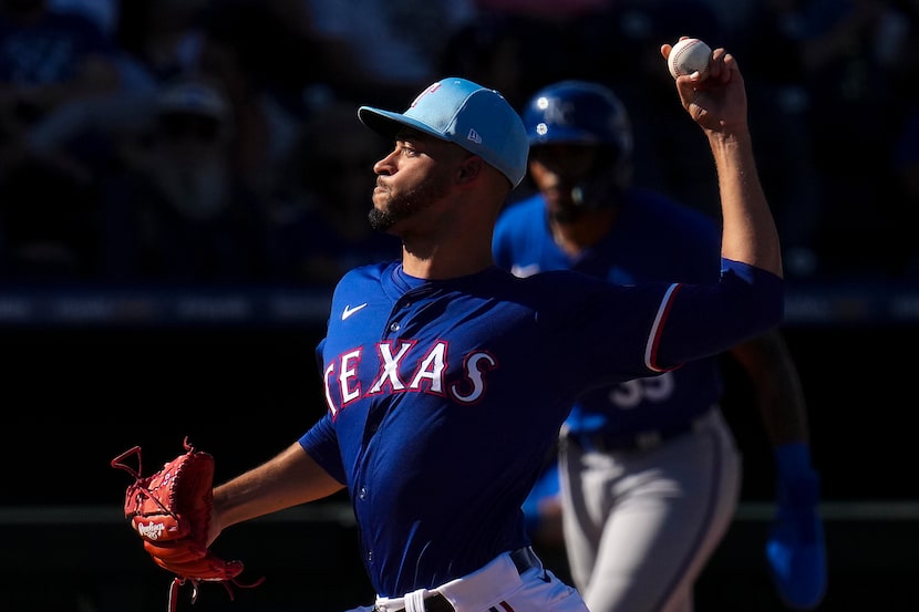 Texas Rangers pitcher Antoine Kelly delivers during the seventh inning of a spring training...