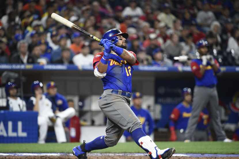 SAN DIEGO, CA - MARCH 15: Rougned Odor #12 of Venezuela hits a solo home run in the seventh...