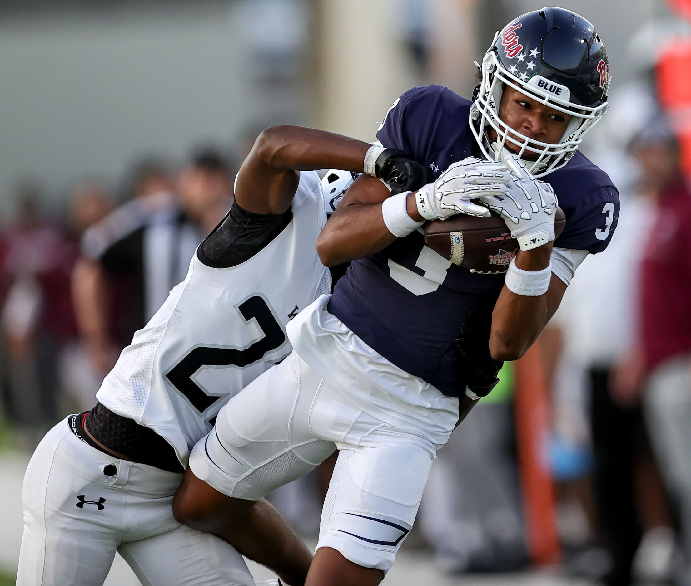 Denton Ryan wide receiver Lorenzo Hill (3) comes up with a long reception against Mansfield...