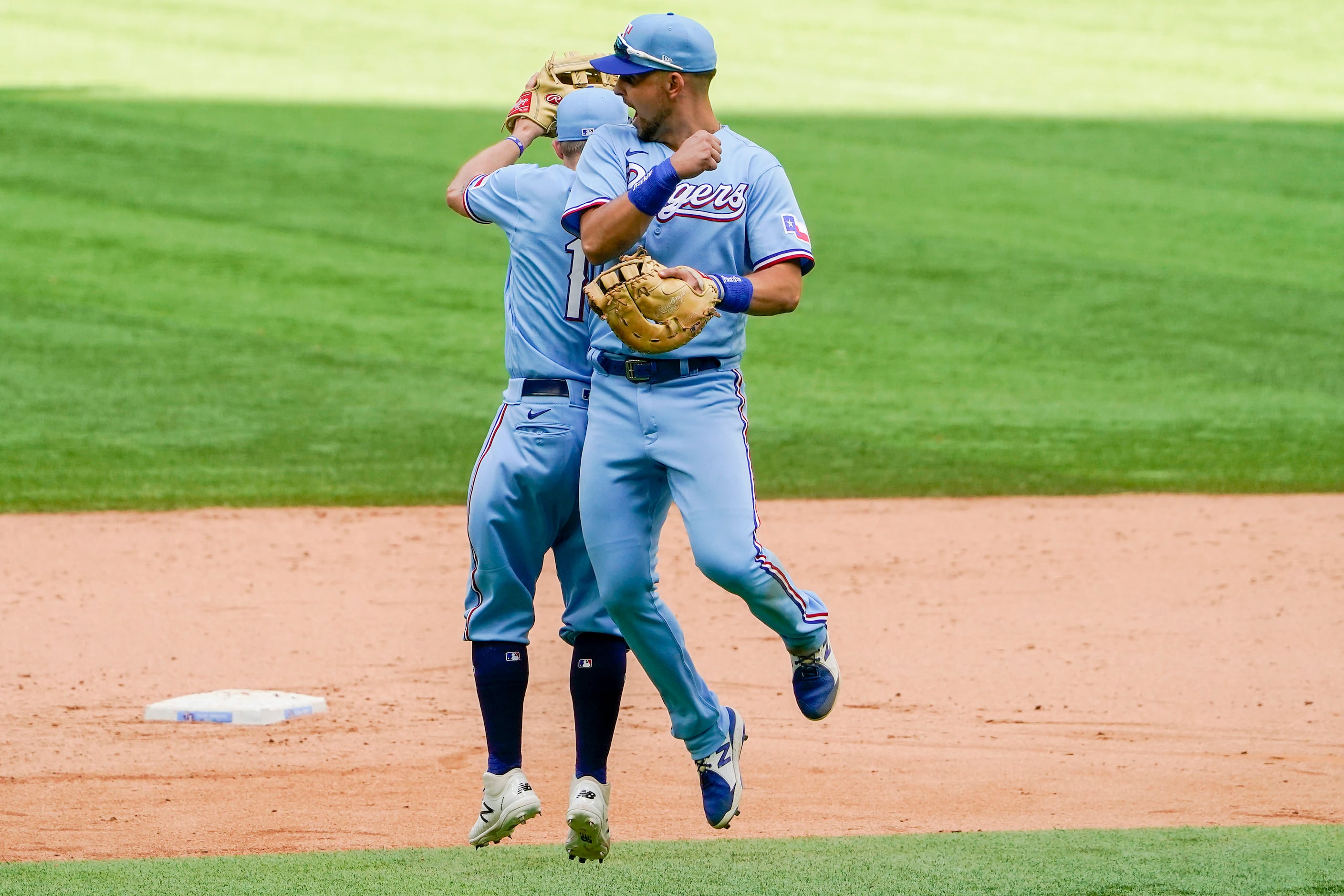 Xander Bogaerts and Brock Holt of the Boston Red Sox celebrate after