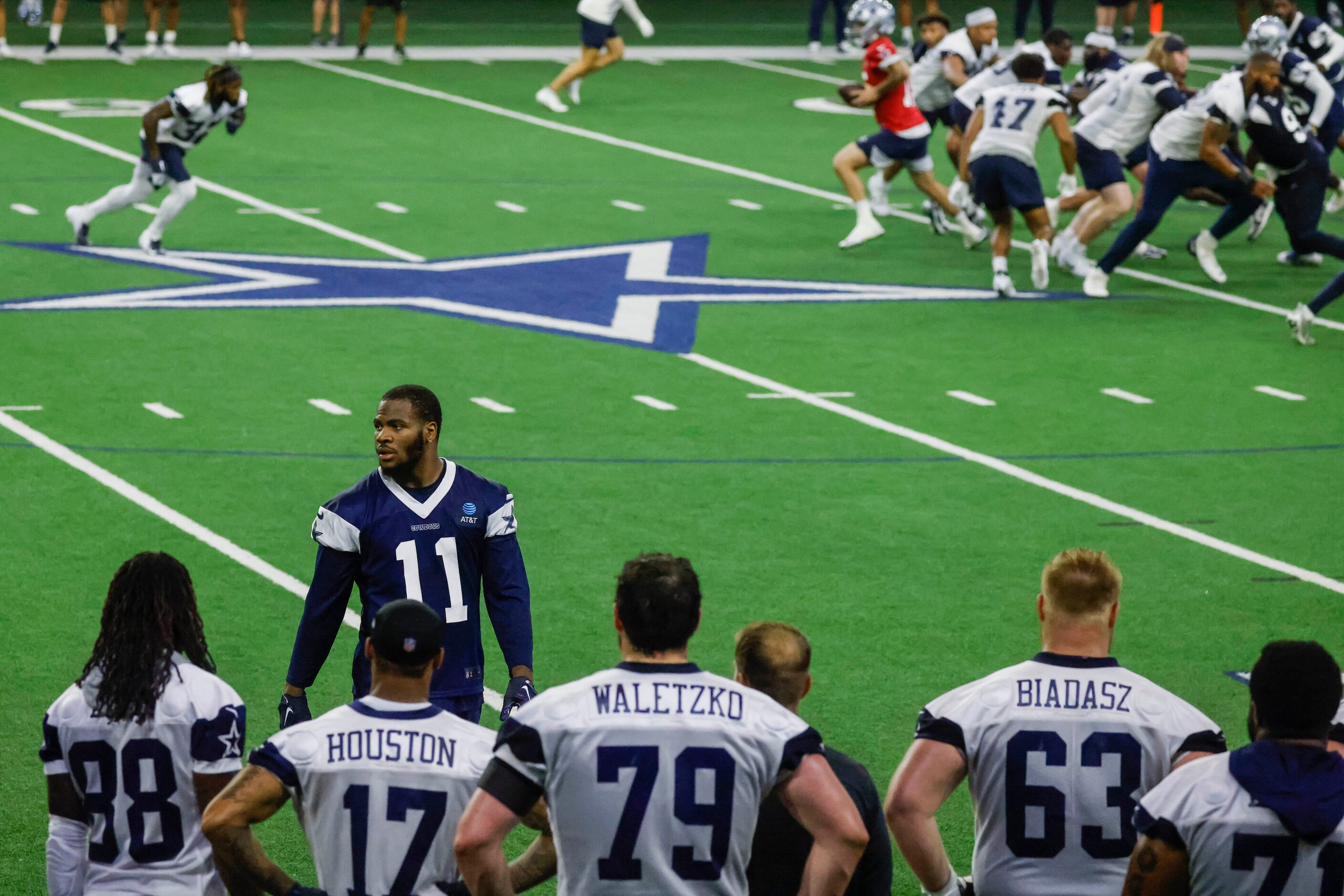 Dallas Cowboys linebacker Micah Parsons leaves the field during timeout in a OTA practice on...