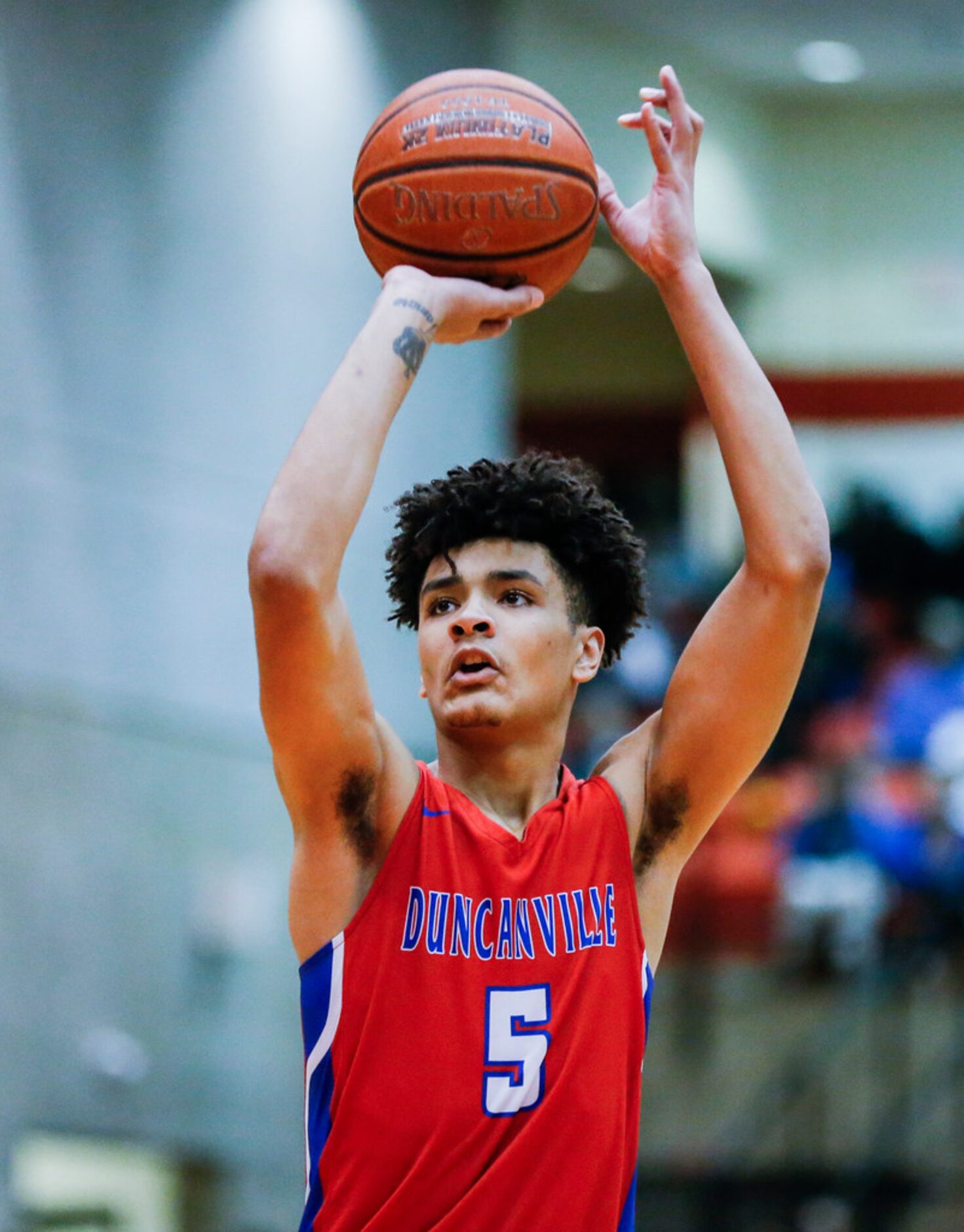 Duncanville junior guard Micah Peavy (5) shoots the game-winning free throw during overtime...