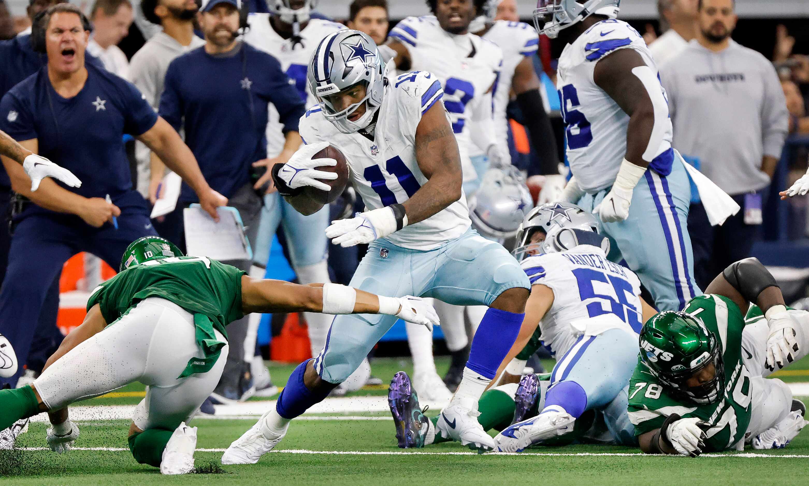 Dallas Cowboys linebacker Micah Parsons (11) picks up the fumble he created by stripping the...