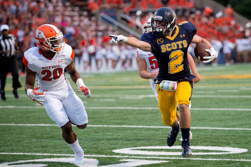 Highland Park senior wide receiver Parker Alexander (2) runs past Rockwall sophomore...